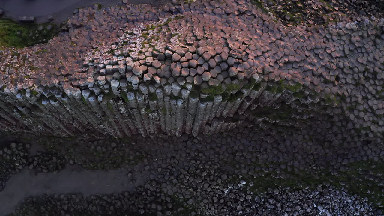 High basalt columns block at the Giant’s Causeway. Aerial perspective showcases its grandeur