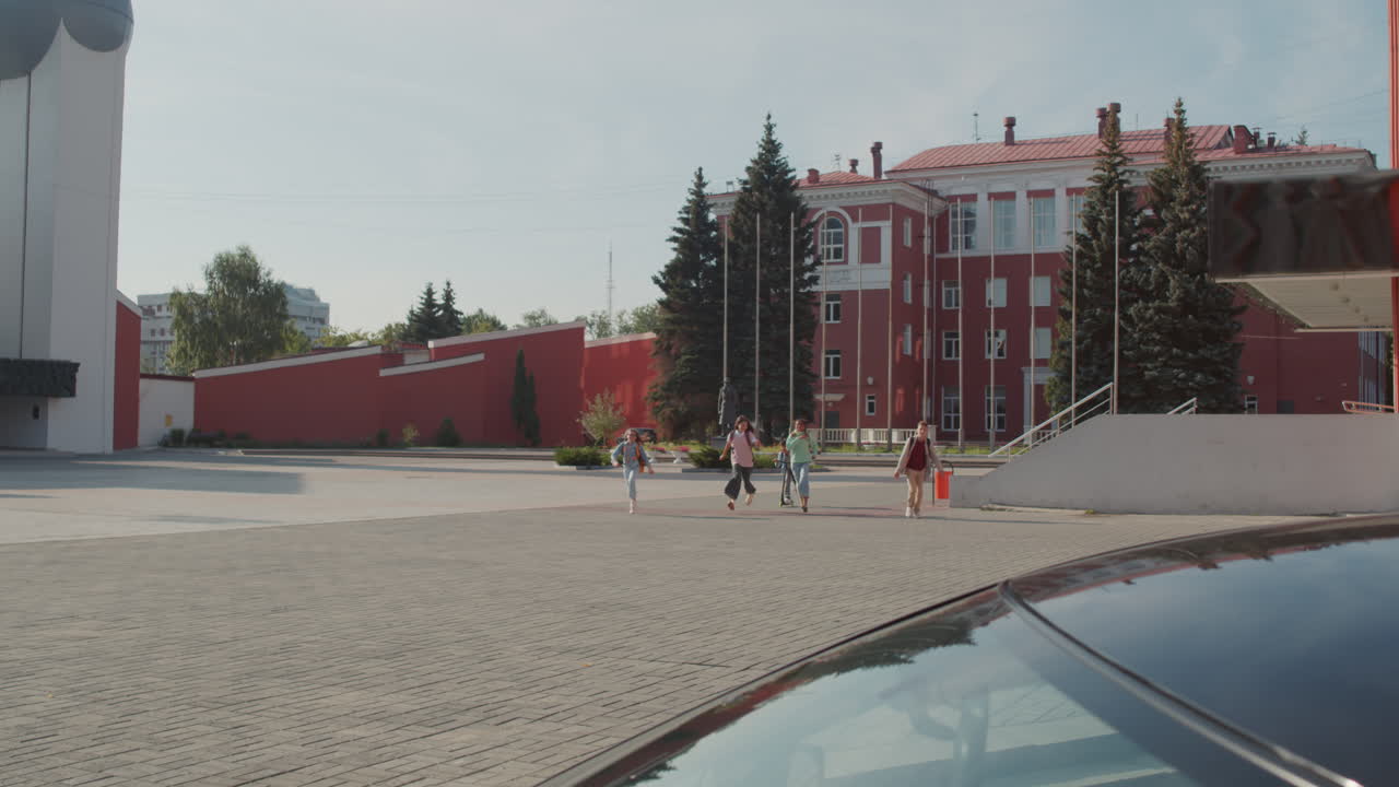 Mother Picking Teen Boy Up from School