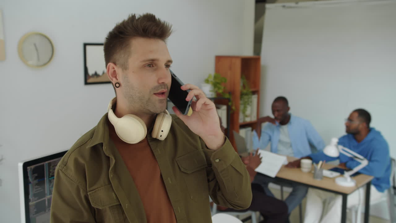 Male Caucasian Product Manager Calling Business Partner on Smartphone