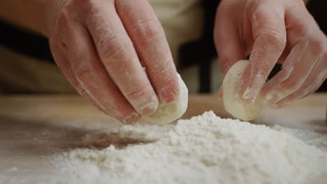 the baker makes dough pieces for baking