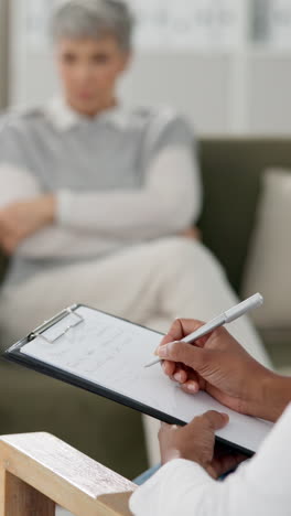 therapist taking notes during a counseling session