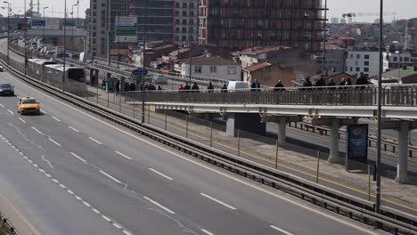 istanbul highway with pedestrian bridge and cityscape