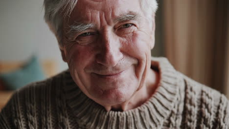 close-up portrait of a cheerful elderly man