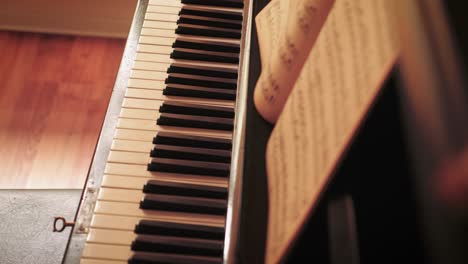 Detail-of-keys-of-an-old-Blüthner-grand-piano,-slow-slider-reveal-shot