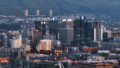 Slide-and-pan-footage-of-modern-high-rise-downtown-buildings.-Zoomed-shot-of-city-centre.-Cape-Town,-South-Africa