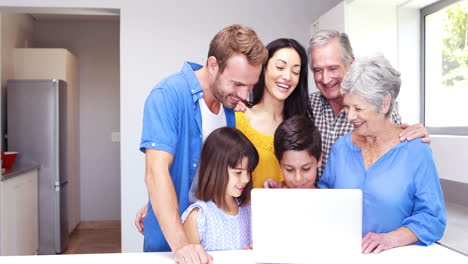 Happy-family-doing-video-chat-on-laptop