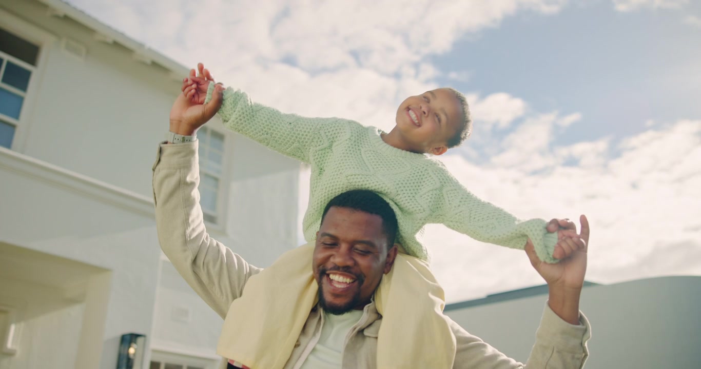 Happy Father Carrying His Daughter on Shoulders Outside