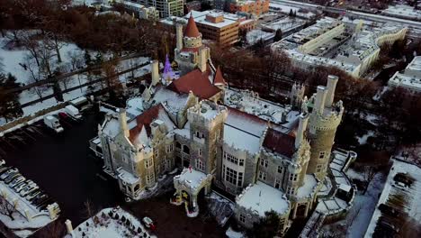 beautiful scene of fairy tale castle in winter, drone orbit pan