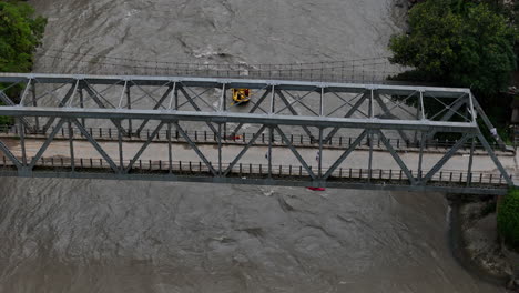 drone shot of tourists rafting in a monsoon-flooded river in nepal captures risky and adventurous water tourism activity as tourists engage in a life-risking adventure in the powerful floodwaters