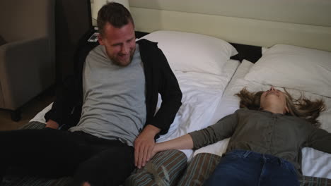 couple relaxing in a hotel room