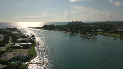 Drone-Flying-over-Inlet-Toward-Ocean-in-Jupiter,-Florida