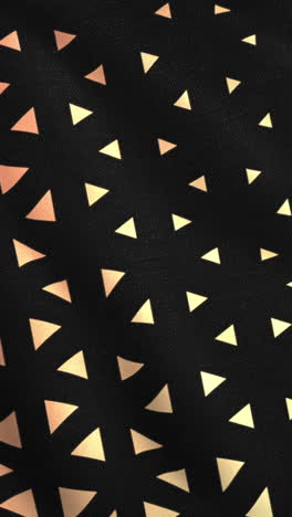 black fabric with gold triangle pattern