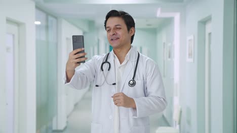 Happy-Indian-doctor-talking-on-video-call