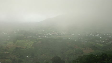 view of the city from a misty mountain in lam dong