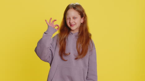 Happy child girl kid showing ok gesture like sign positive feedback celebrate victory approve idea