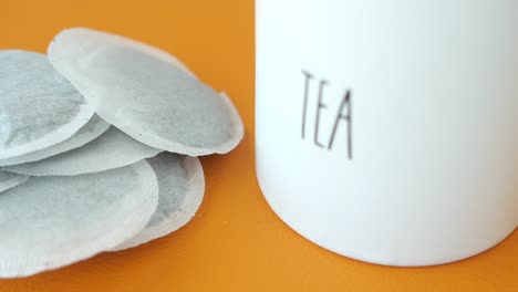 close up of tea bags and a white cup