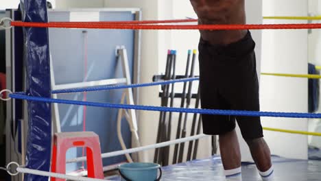 male boxer relaxing in boxing ring 4k