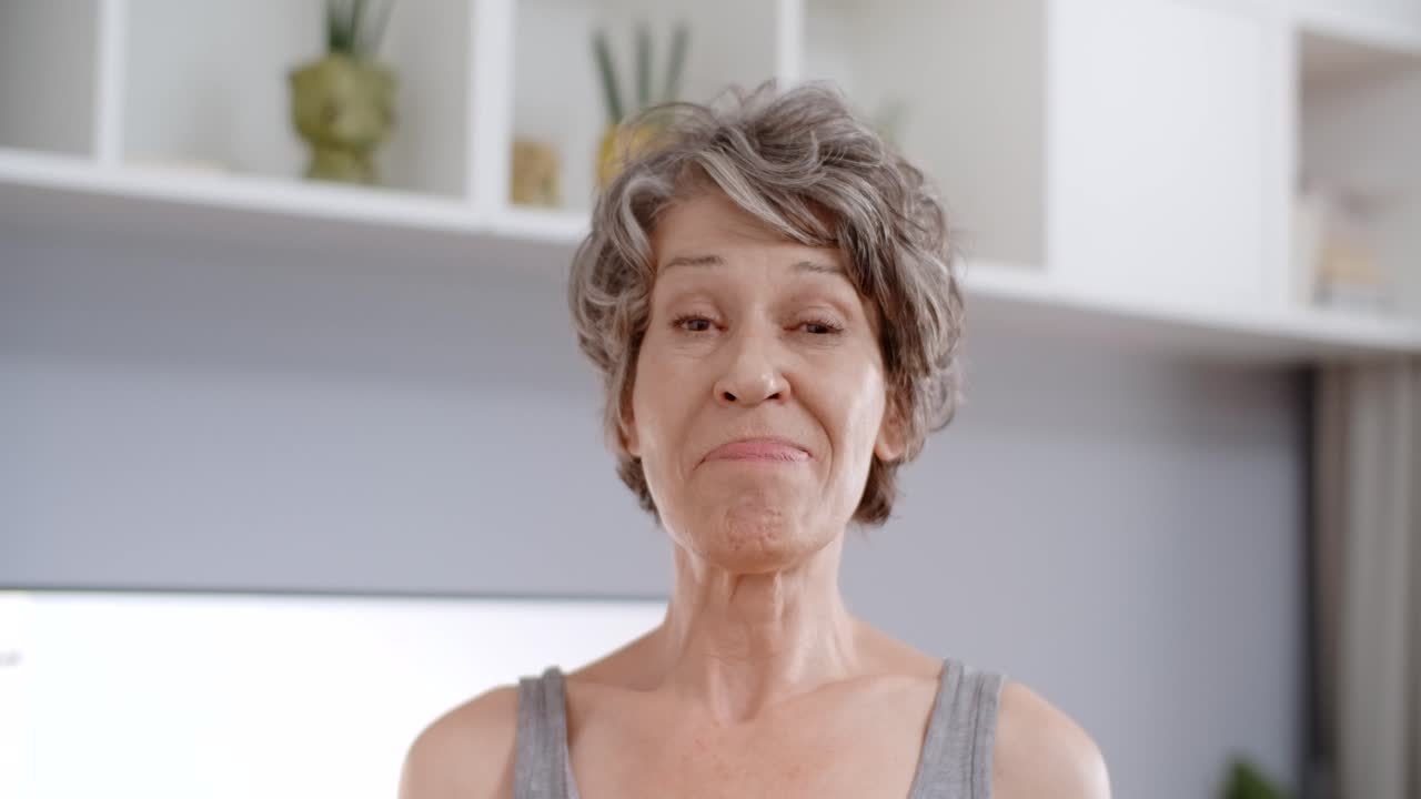 Senior Woman Doing Yoga at Home