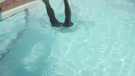 Handsome-man-diving-in-the-pool