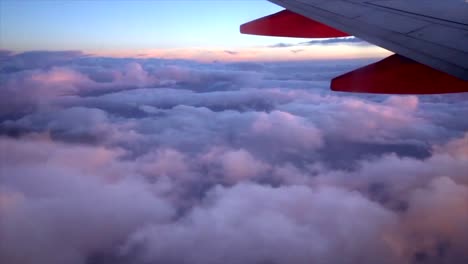 flying in airplane above clouds