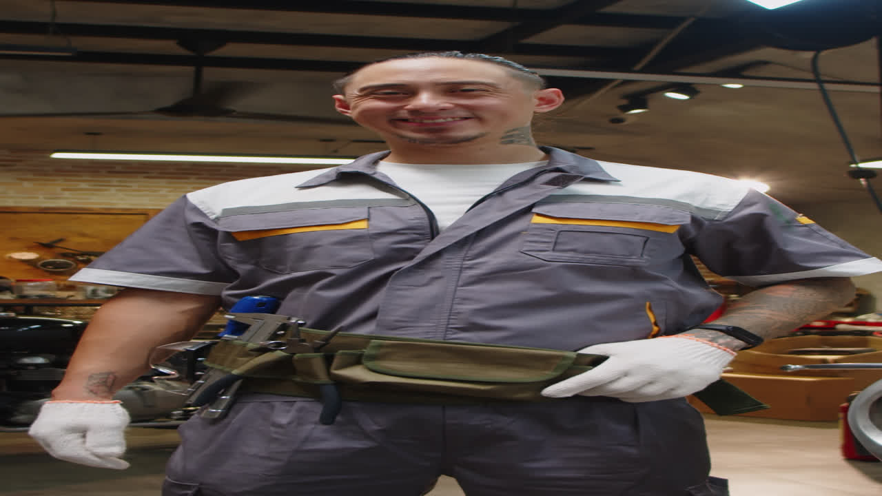 Vertical Portrait of Multiethnic Mechanic in Garage