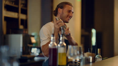 bartender mixing cocktails at counter