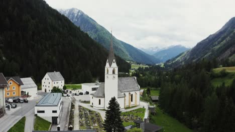 alpine village church with mountain views