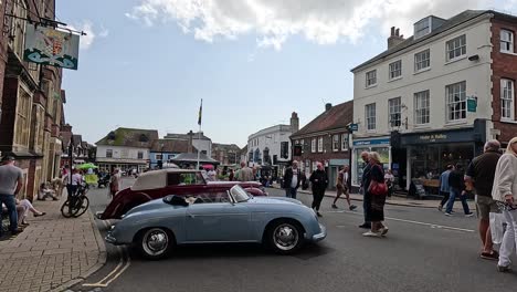 people and cars in a bustling street