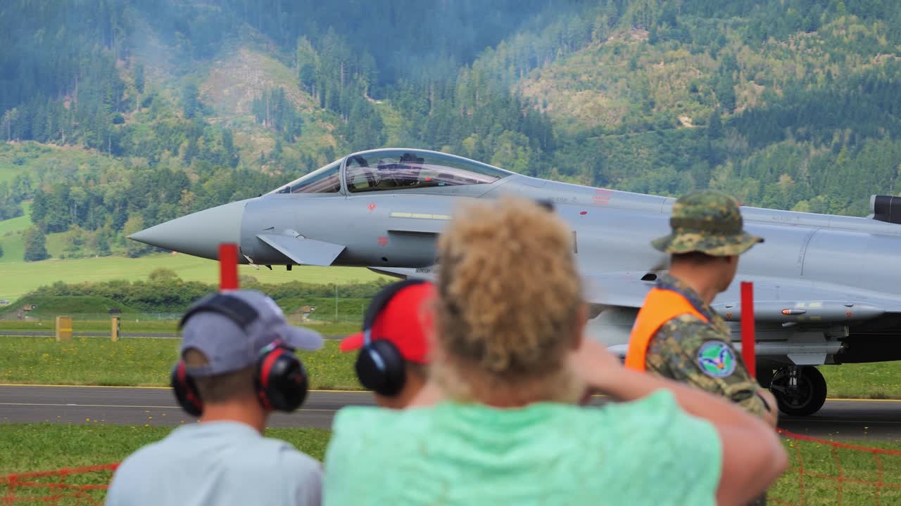 A Eurofighter military fighter aircraft rolls down the runway and waves to spectators at airpower 2024