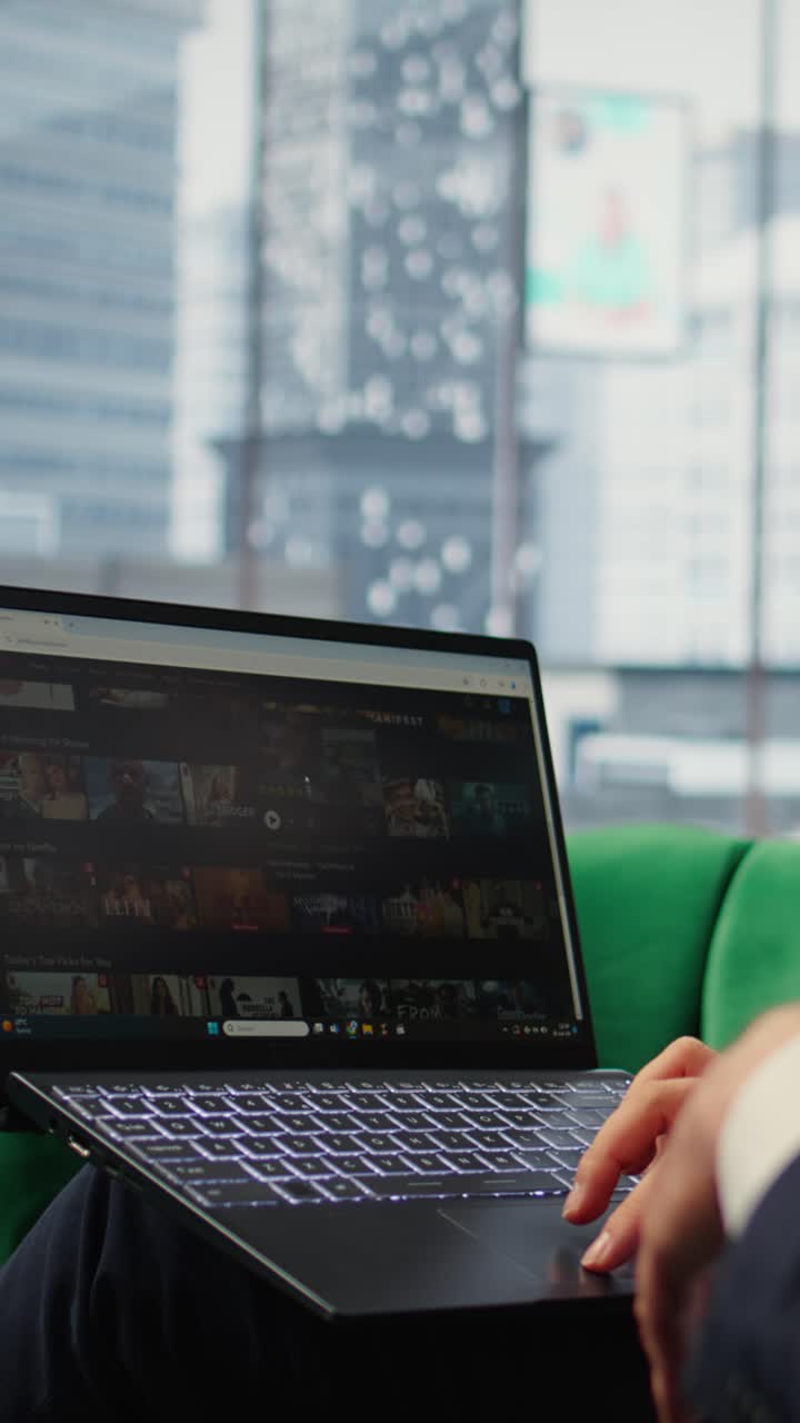 Vertical Video Bucharest, Romania - July 30th 2024 - CEO browsing Netflix streaming platform