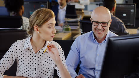 caucasian office employees working on the computer in the office