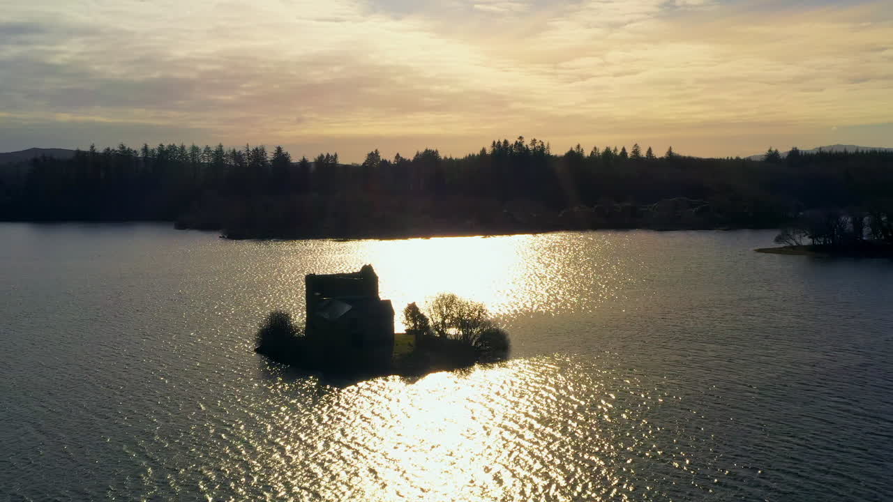 Aerial tracking shot of O'Flaherty Castle. Establishing shot
