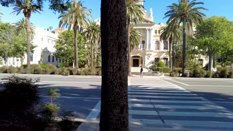 malaga city hall, yellow building in malaga on a sunny summer day