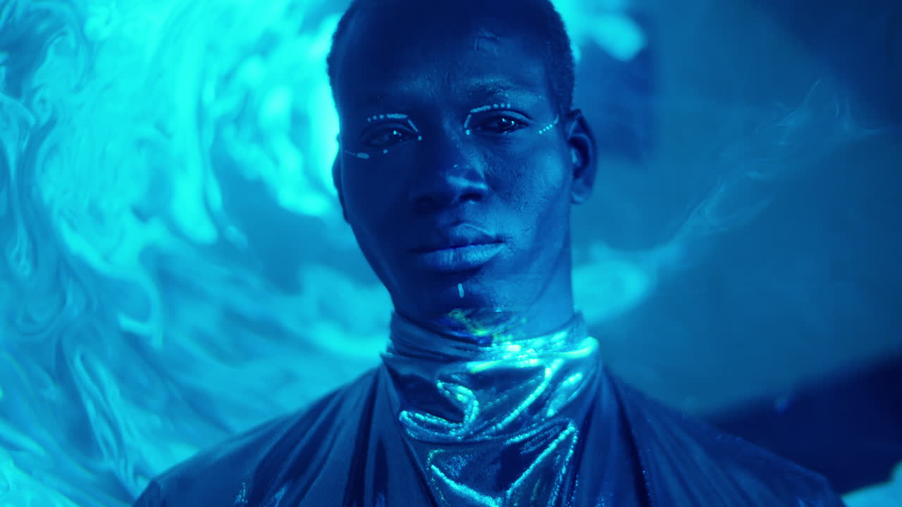 Portrait of Male Model with Tribal Makeup in Laser Light