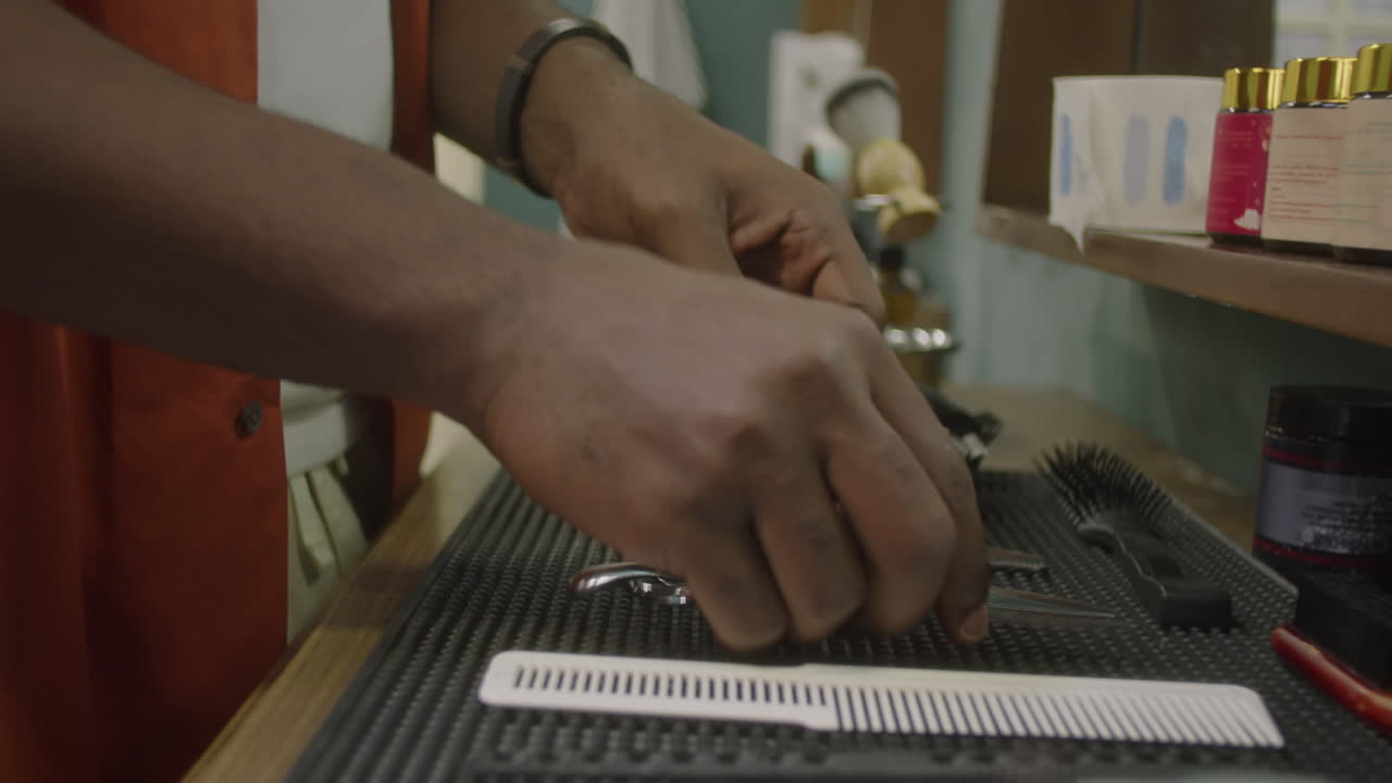 Barber Preparing Hairdressing Tools for Workday