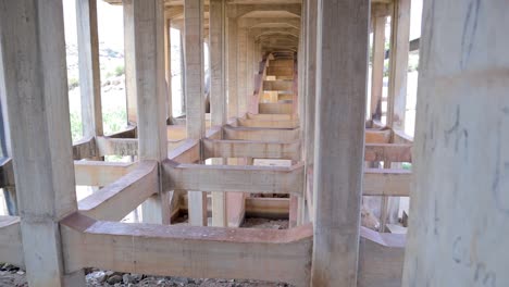 pan view through the wall of abandoned and disused bridge near hampi, india