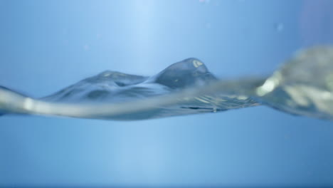 refreshing aqua clean water droplets cascading in slow motion