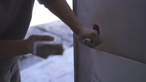 Worker-Hitting-Chisel-with-Hammer,-Demolition-of-Wall