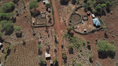 aerial top down view on rural area with traditional masai homesteads in kenya