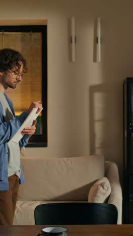 man writing in living room