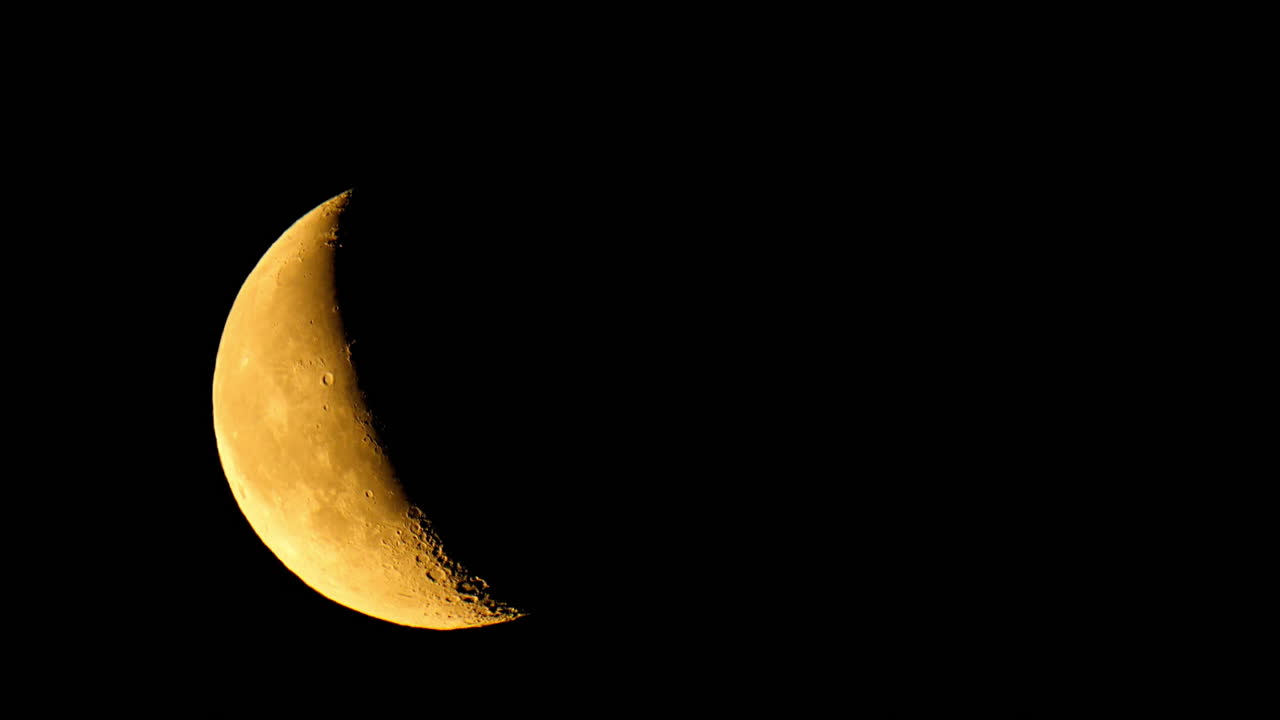 Timelapse of the moon over a dark sky in Estonia, showing its slow movement across the night