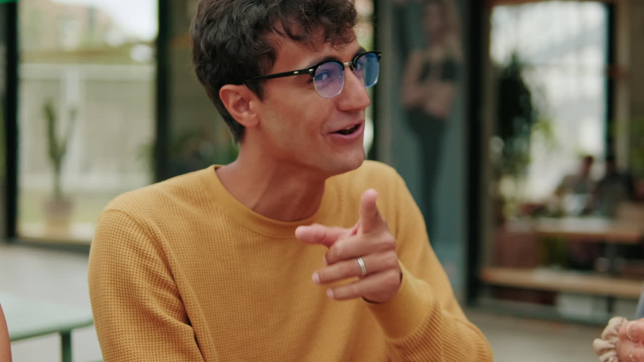 Lunch communication. International joyful students eating, talking and laughing