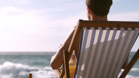 a man is relaxing with a drink