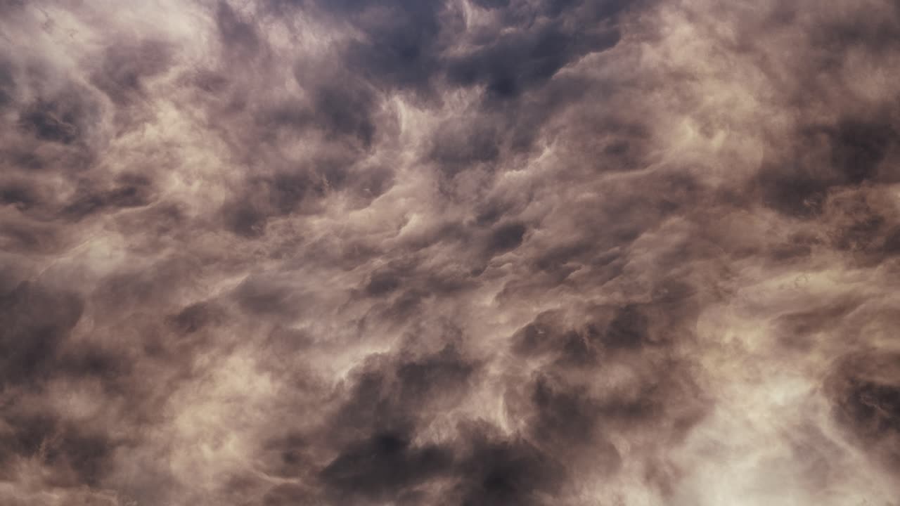 thick yellow clouds with flashes of lightning