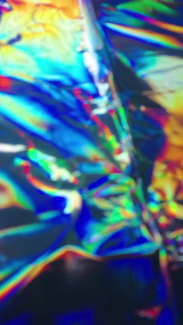 Sfondo Astratto di Rosso Scintillante e Lamina Olografica Iridescente