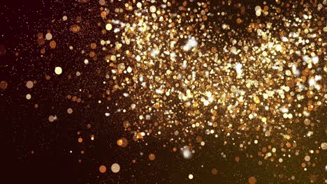 sparkling golden particles floating upwards on a dark background