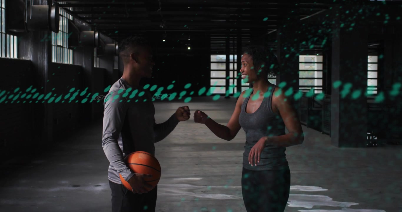 Man passing orange basketball to woman, bumping fists for training, green overlay sweeping faces