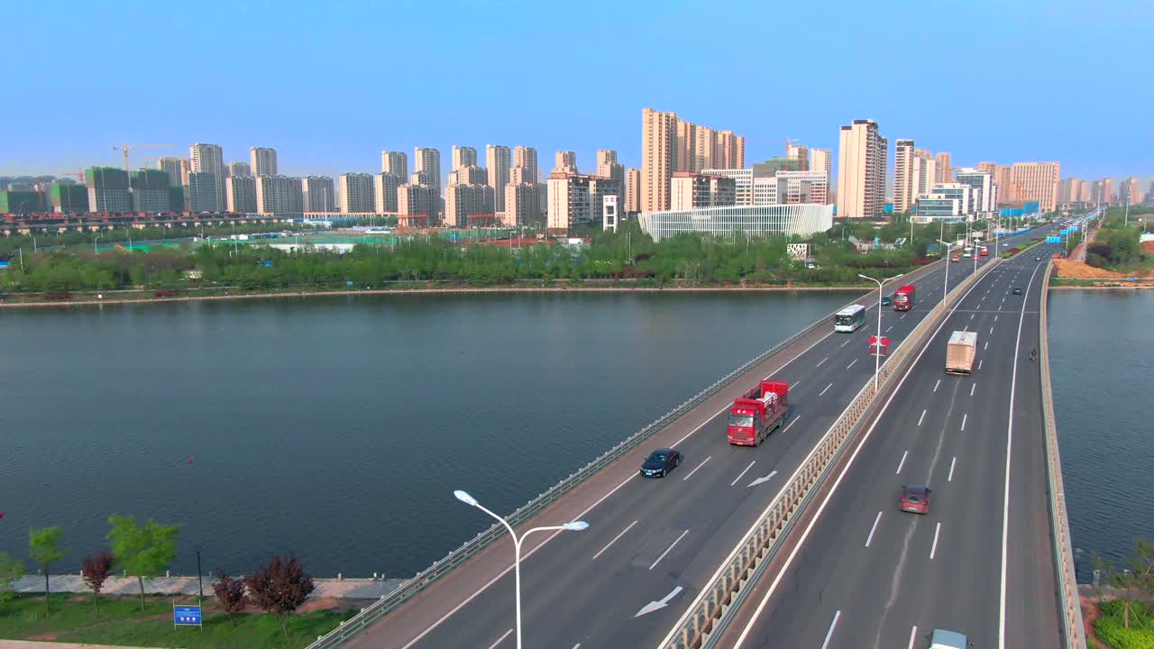 See the beautiful urban environment from the aerial perspective ，Aerial photography of urban high-rise road vehicles ，