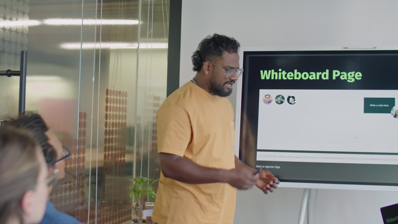Man Showing Presentation on Digital Screen and Speaking on Meeting