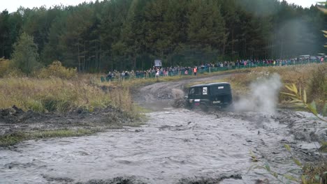 off-road vehicle competition in a muddy river